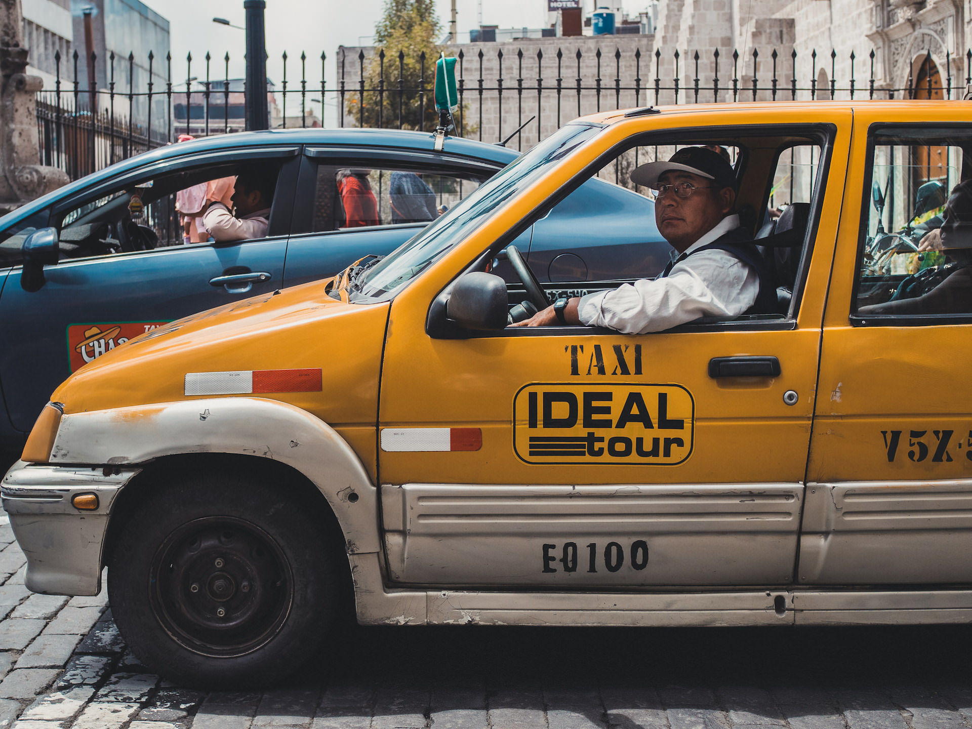 Taxi driver in orange cinquecento
