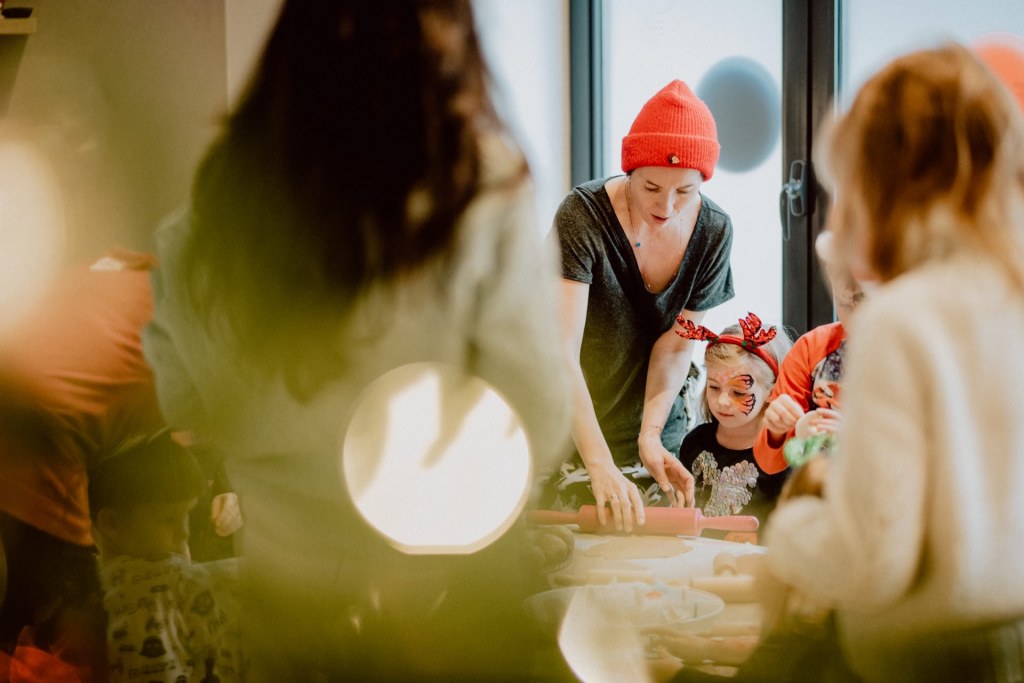 Mom makes Christmas gingerbread with her daughter during educational activities
